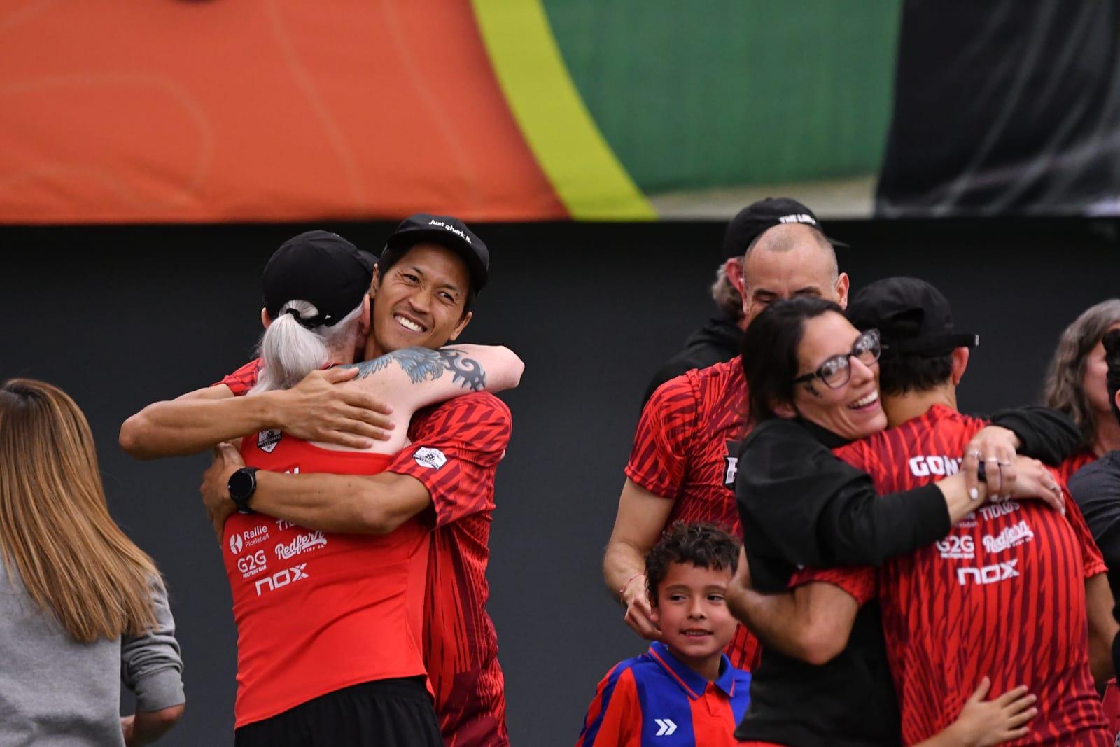 Bangers hug after the final