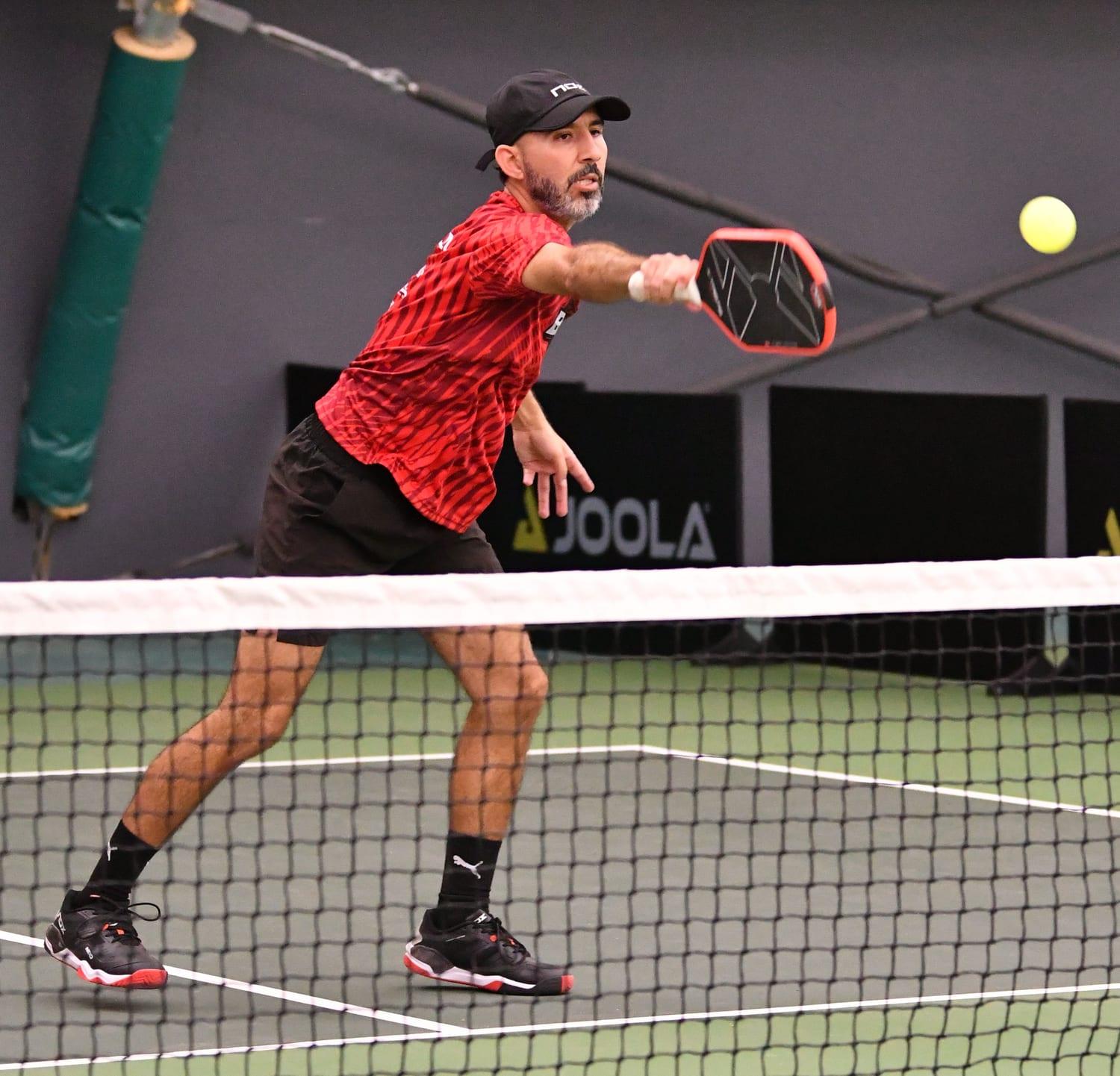 Izaak Gonzalez at the net